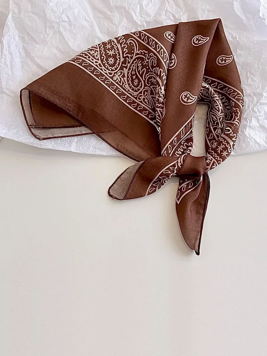 Kinkuu bandana in the brown paisley print, tied and laid flat