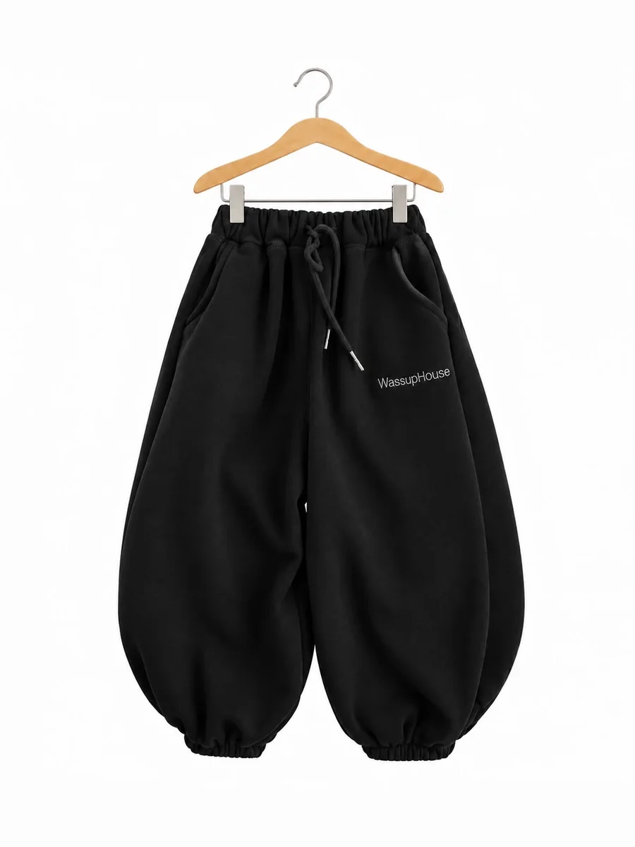 The balloon joggers in black, on a hanger