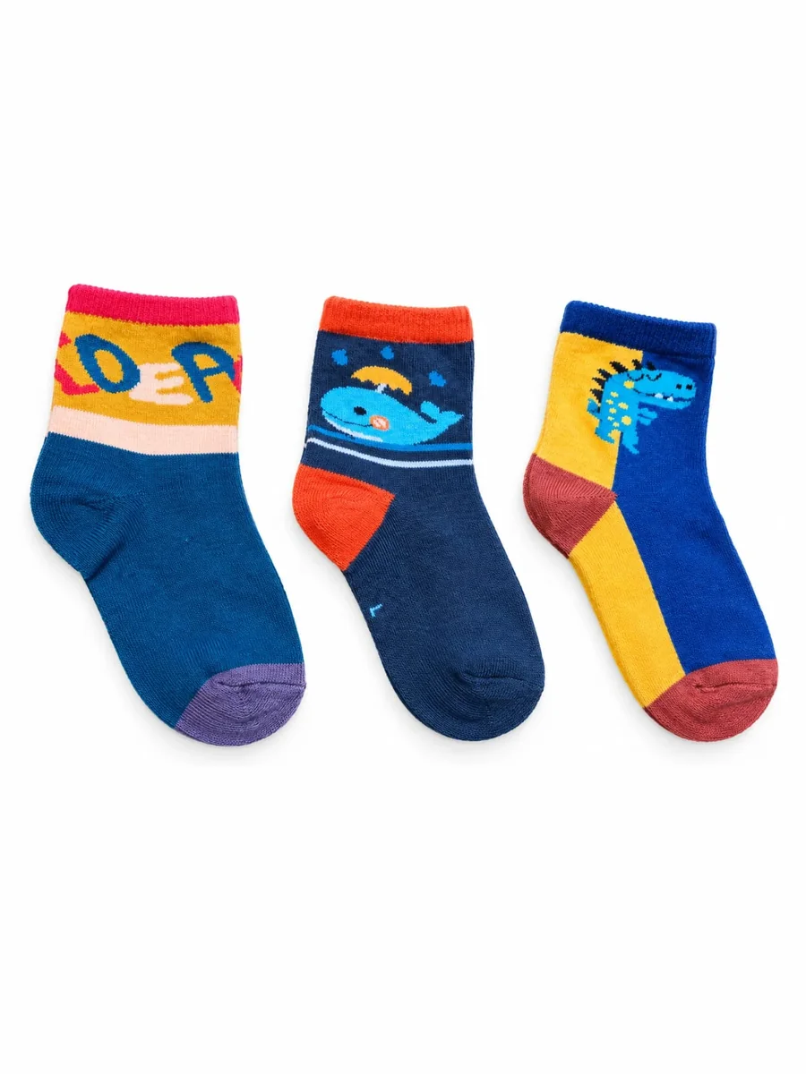 Kinkuu socks, a set of 3 pairs: a teal sock with lettering, a navy sock with a whale, and a yellow and blue sock with a dinosaur